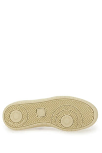 Beige rubber sole with herringbone tread and circular design elements on veja women’s sneaker white