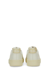 Back view of cream-colored vegan leather veja women’s sneaker with minimalist design and embossed brand name on heel