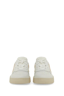 Veja women’s sneaker white low-top white leather with beige rubber soles and subtle gold-tone branding on the side