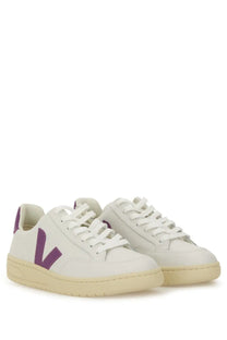 Veja women’s white leather sneakers with bold purple v logo, matching heel tab, and cream rubber sole