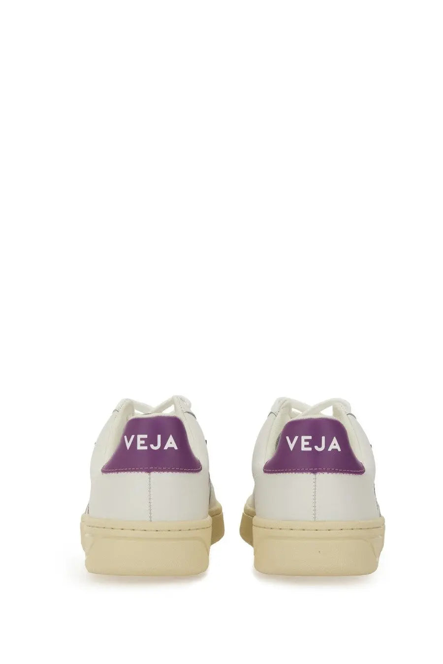 Veja women’s sneaker white leather with purple heel tab featuring veja logo and cream rubber soles shown from back