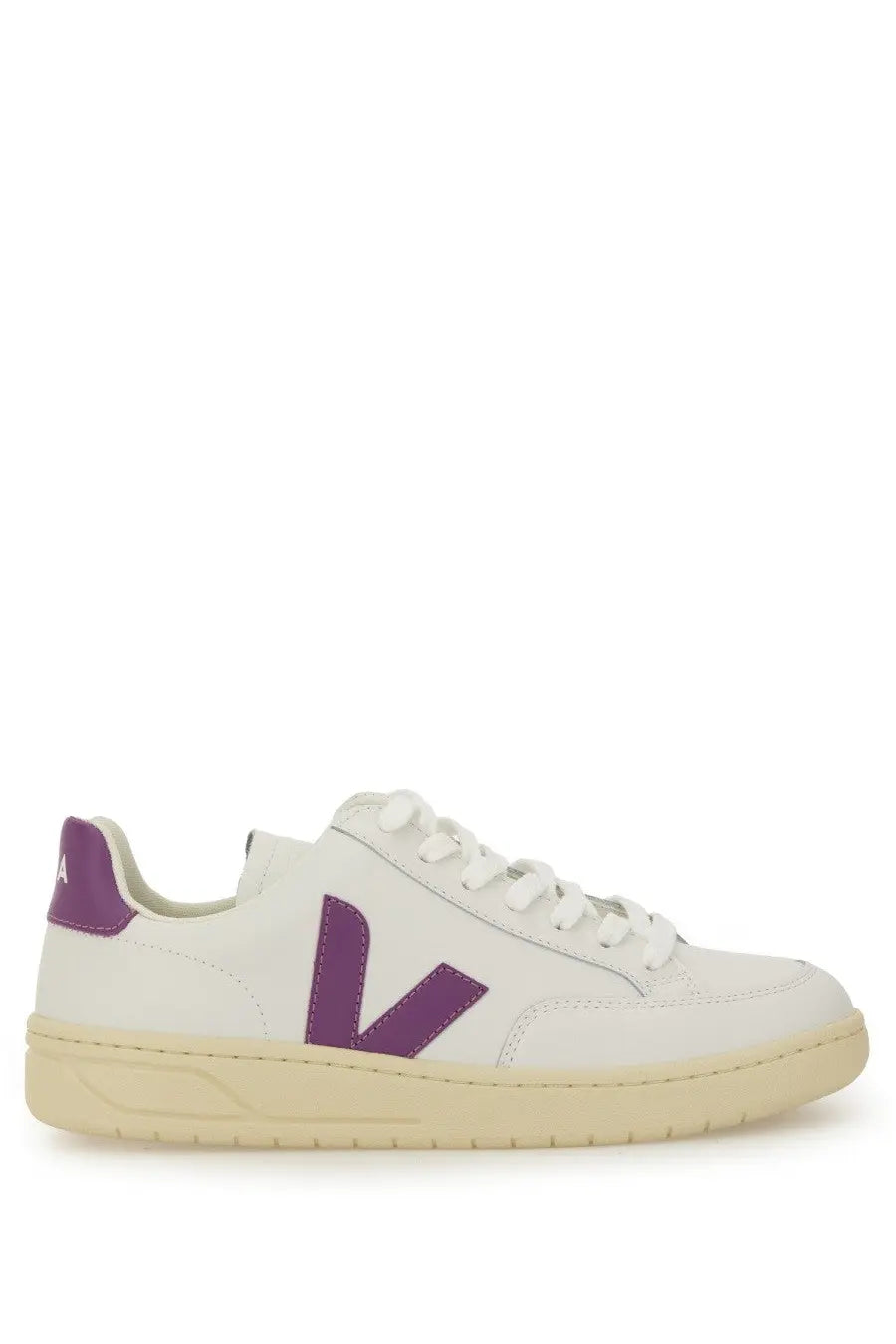 Veja women’s sneaker white featuring white leather with a bold purple V logo and matching purple heel tab