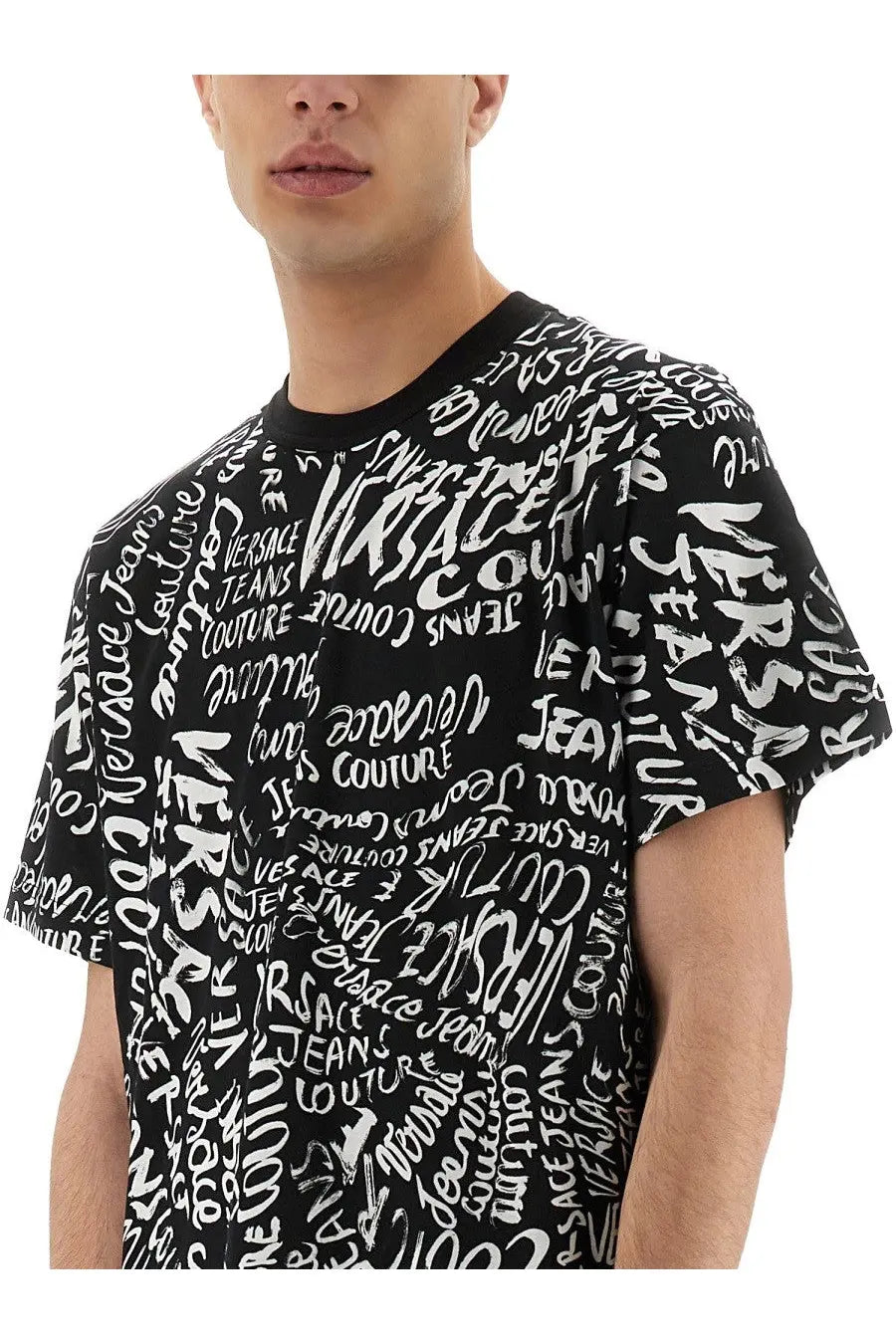 Versace jeans couture men’s black short-sleeved t-shirt with bold white graffiti style logo print all over