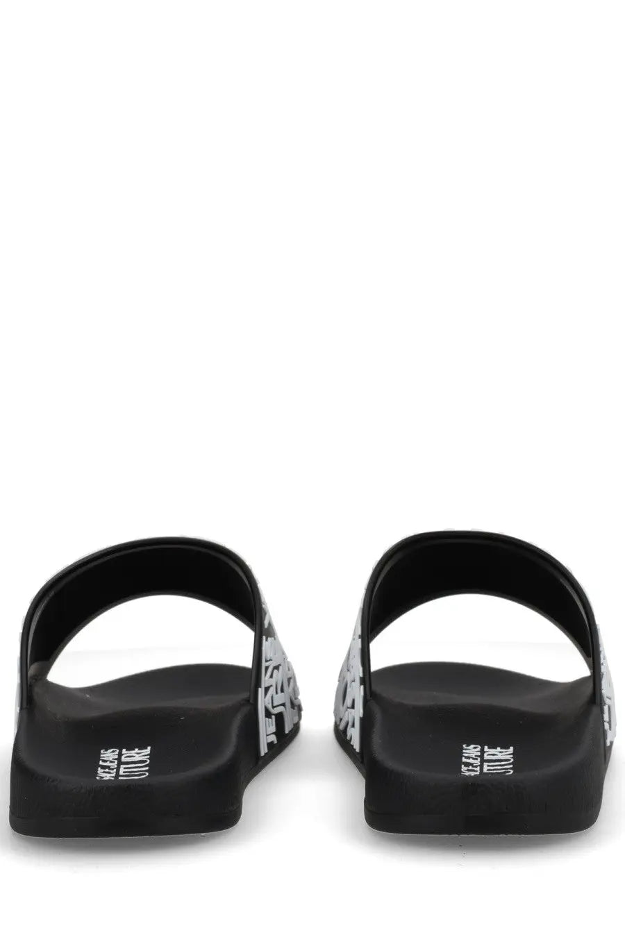 Versace jeans couture men’s black slide sandals with bold white graphic pattern and jeans vintage branding on the heel back side