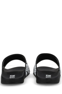 Versace jeans couture men’s black slide sandals with bold white graphic pattern and jeans vintage branding on the heel back side