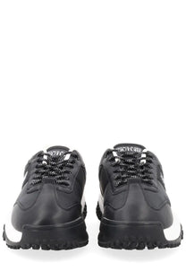 Versace Jeans Couture men’s sneaker con black featuring black and white leather upper with bold rubber sole and contrasting laces