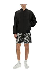 Versace jeans couture men’s black bomber jacket with glossy finish and subtle white baroque pattern on lower half