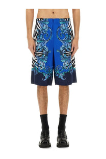 Versace jeans couture men’s viscose shorts in vibrant blue with ornate swirling pattern and black and white zebra stripes