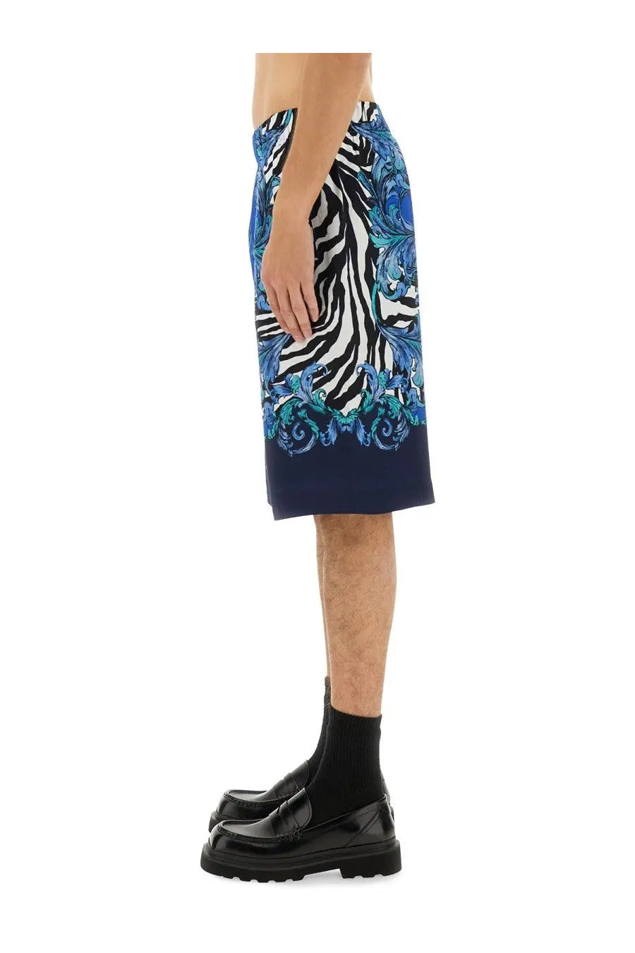 Versace Jeans Couture men’s viscose shorts in blue featuring vibrant blue and white zebra print with teal floral details and navy hemline