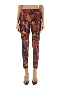 Versace Jeans Couture women’s fitted leggings with bold swirling orange and brown leopard spot pattern in multicolor