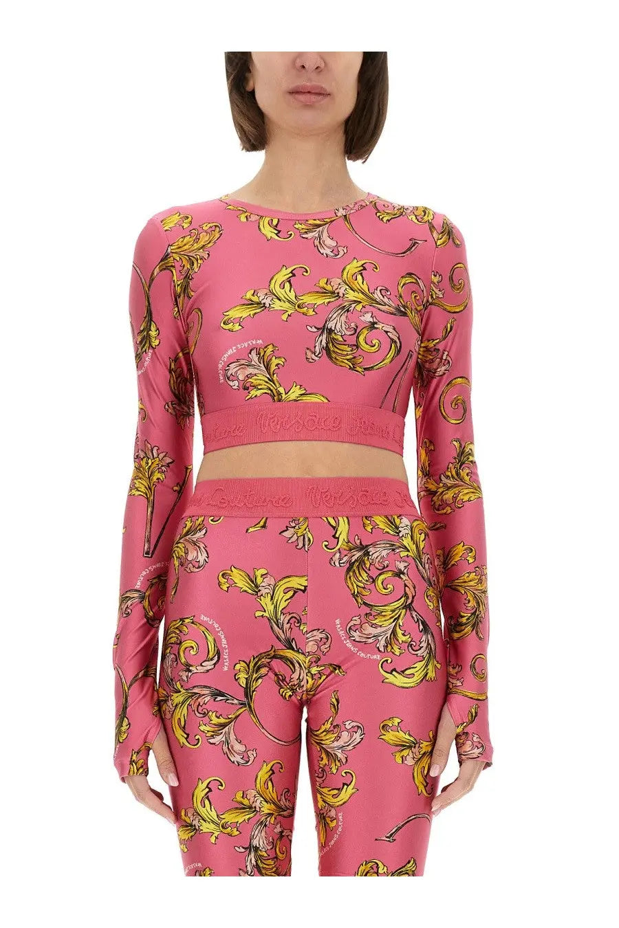 Versace jeans couture women’s pink long-sleeved crop top and leggings set with bold yellow gold baroque floral pattern