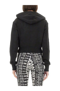 Versace Jeans Couture women’s black cropped hoodie with long sleeves and ribbed waistband in sweatshirt style