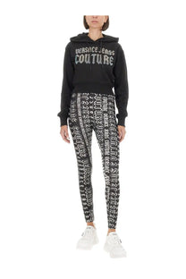 Versace Jeans Couture women’s black cotton hoodie with bold white lettering and matching patterned leggings