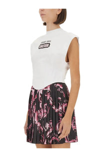 Versace jeans couture women’s white sleeveless top with black and white logo paired with a pink and black floral skirt