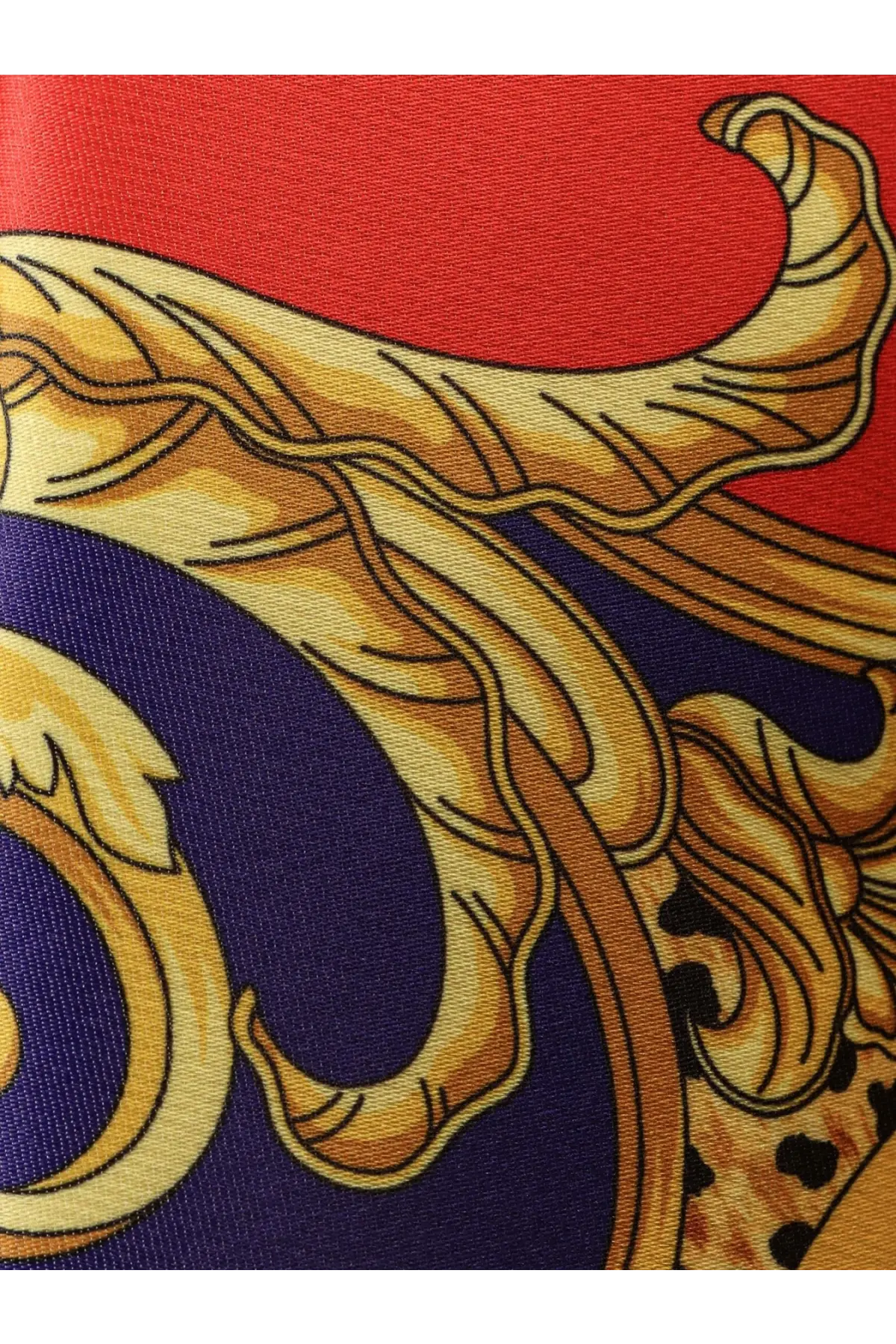 A luxurious red and navy silk scarf with an ornate gold-toned baroque design by Versace