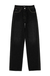 Versace women’s black denim jeans with silver studs along side seams and front pockets featuring high-rise waistband