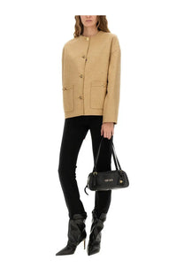 Black leather versace handbag with gold-tone hardware and logo detailing paired with versace women’s medusa buttoned beige jacket