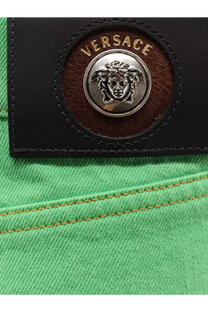 Versace women’s non stretch cotton trousers green featuring green denim jeans with black leather patch and silver medusa emblem