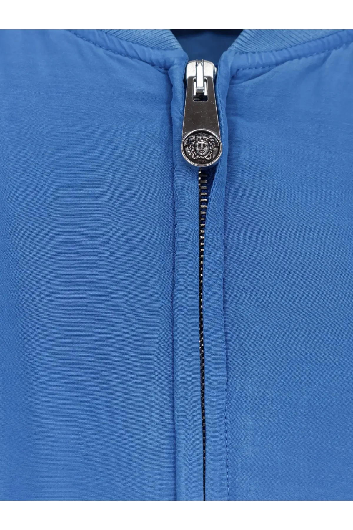 Versace women’s azur blue quilted silk jacket with silver medusa head zipper pull