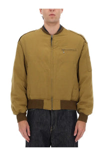 Visvim men’s gunner down jacket brown tan bomber jacket with ribbed brown cuffs collar and waistband visible front view