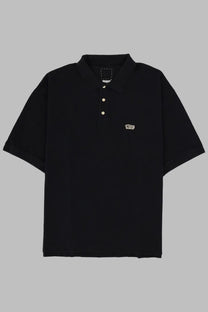 Visvim men’s black short-sleeved polo shirt with white buttons and small embroidered vans logo on left chest