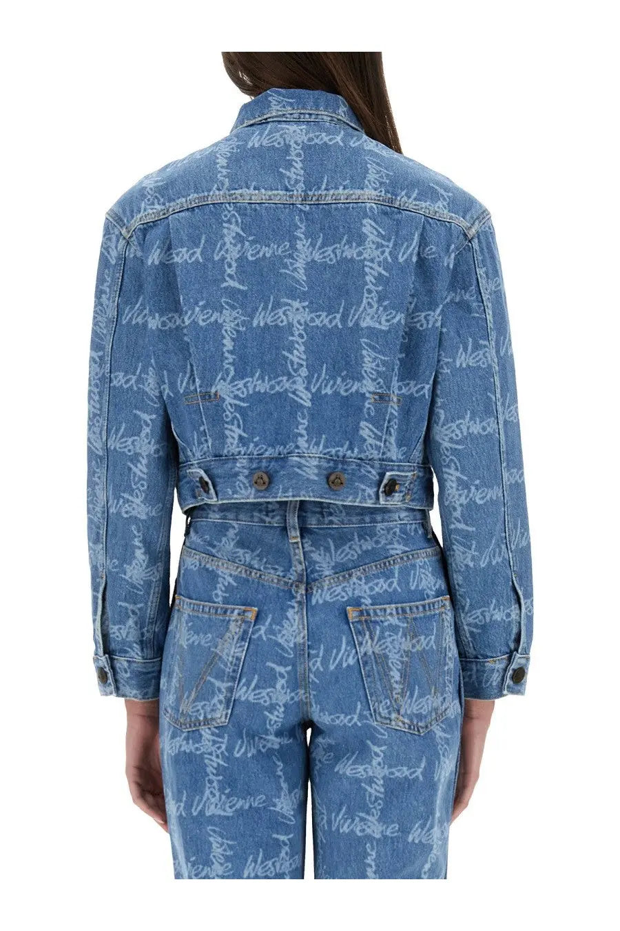 Back view of vivienne westwood womens cropped blue denim jacket with repeating white westwood script print on sleeves and back