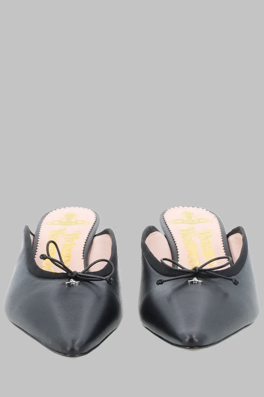 Vivienne Westwood women’s black leather mules with pointed toe and small bow at the front
