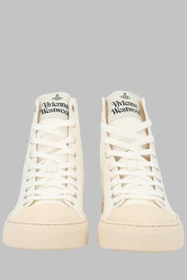 Cream-colored high-top canvas sneakers with white laces and vivienne westwood logo on the tongue
