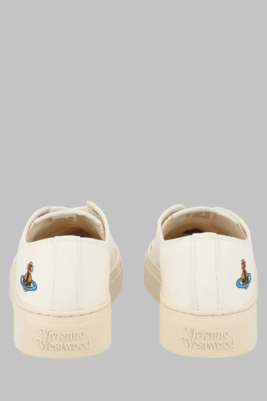 Back view of cream-colored vivienne westwood women sneaker low top plimsoll slip-on with embroidered logo heel detail