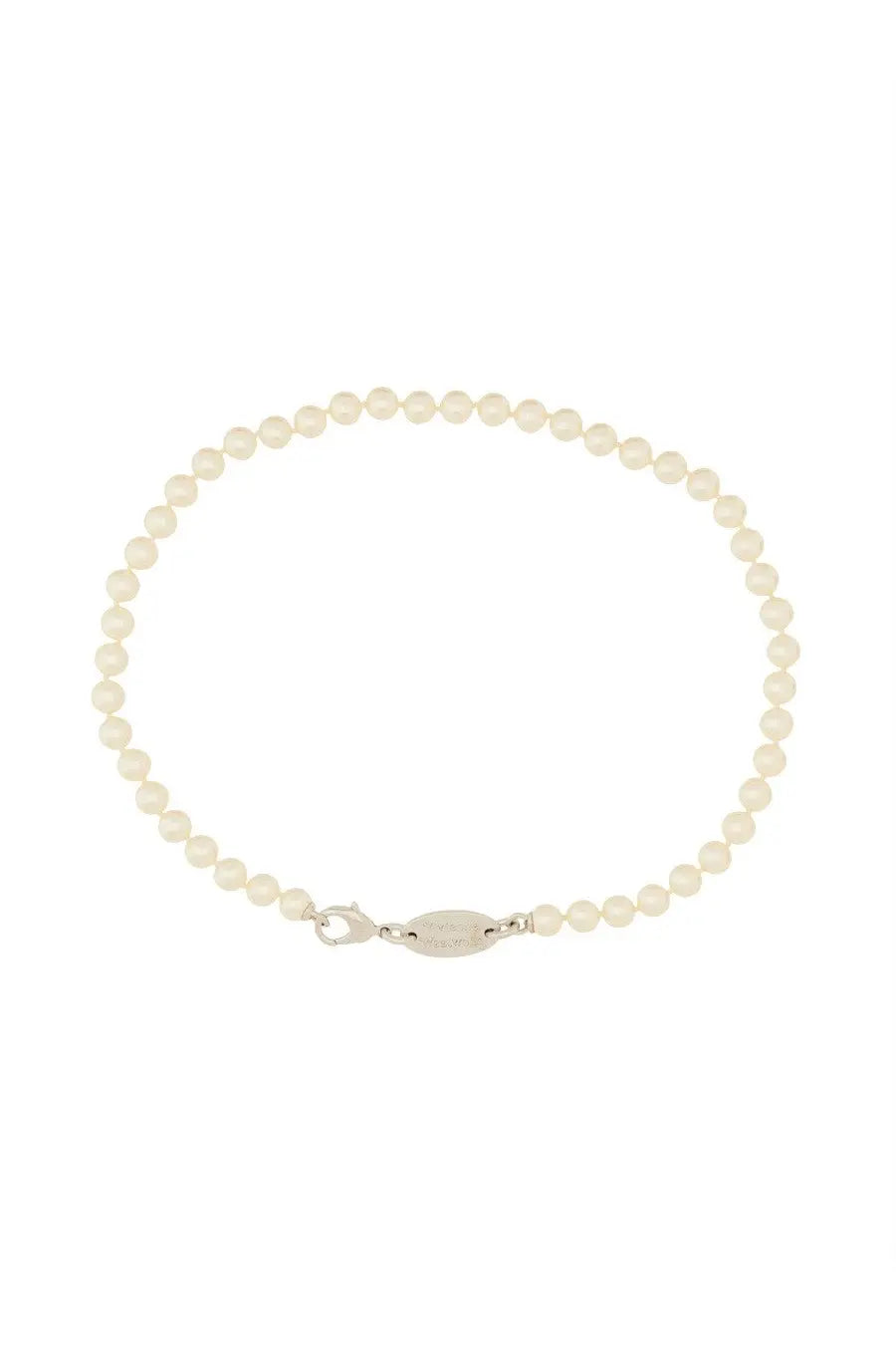 A delicate white pearl bracelet with a sleek silver clasp complementing Vivienne Westwood silver necklace
