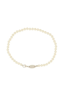 A delicate white pearl bracelet with a sleek silver clasp complementing Vivienne Westwood silver necklace