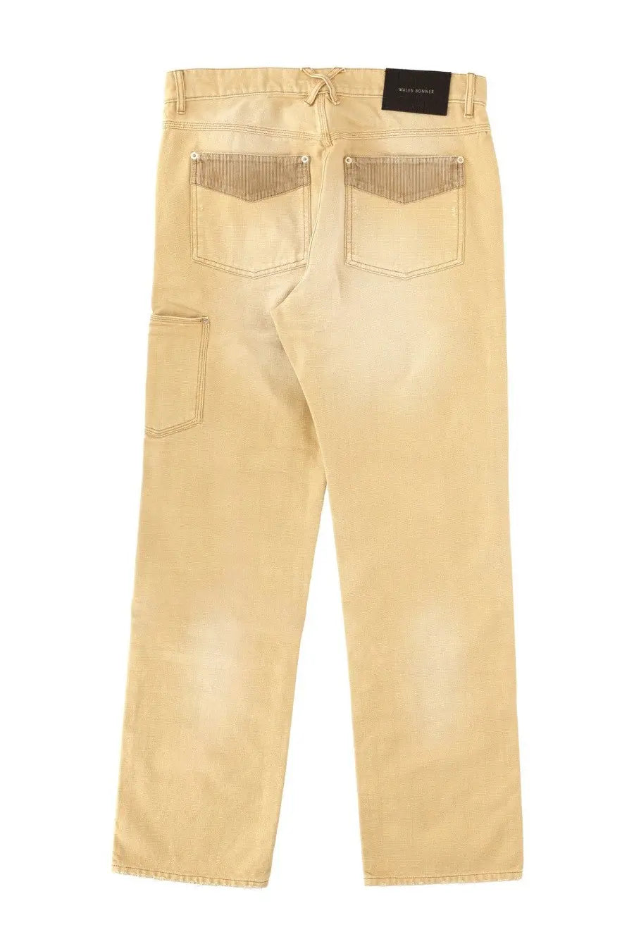Back view of wales bonner unisex jeans in sierra brown beige denim with tan back pockets and black waistband label