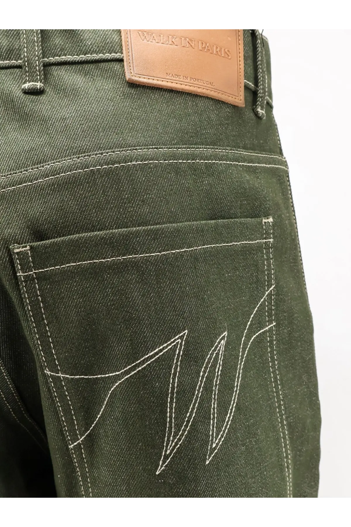 Back side of walk in paris men’s double knee green denim trousers in dark olive green with white logo stitch and brown patch