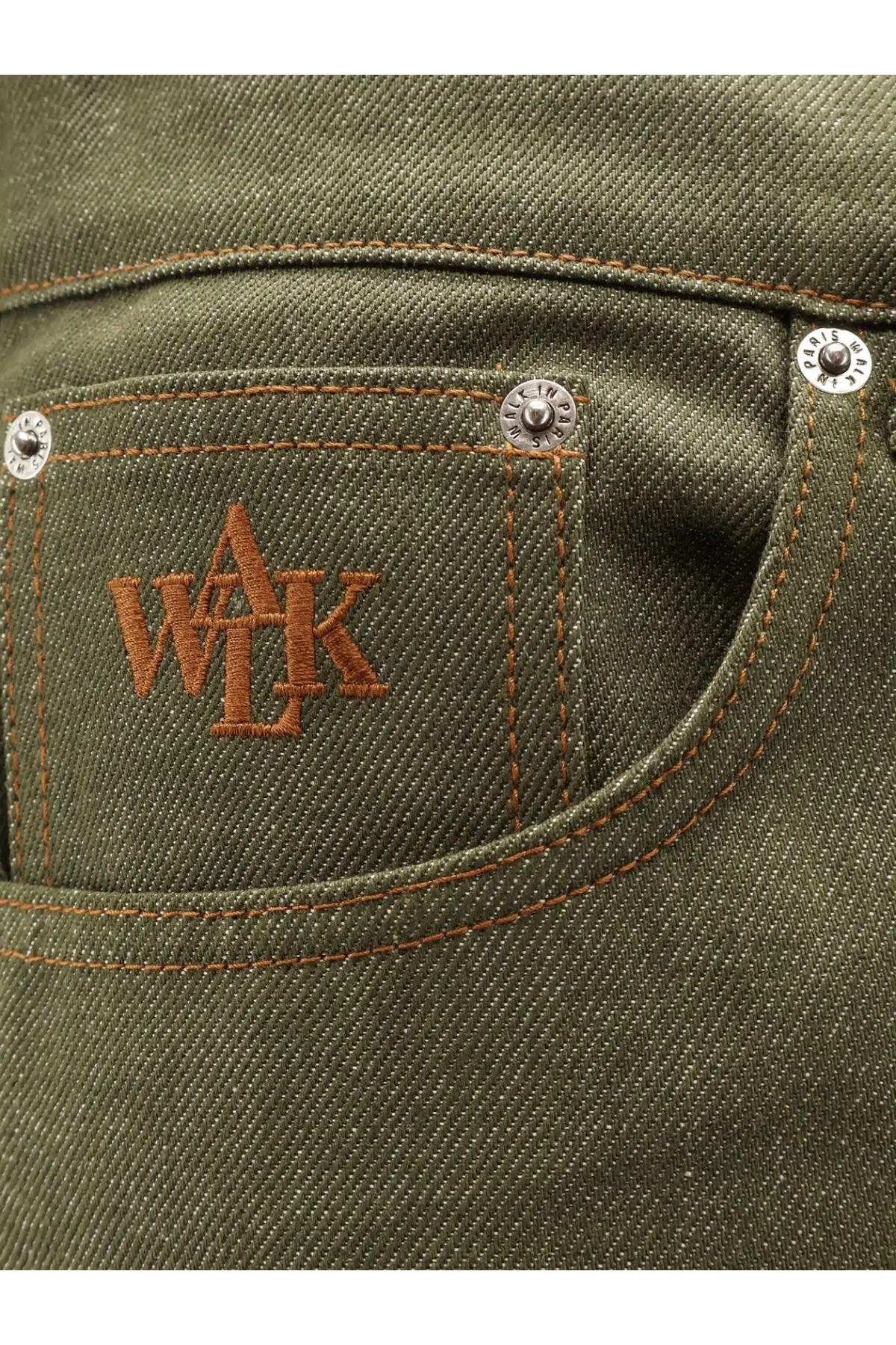 Olive green denim jeans pocket with brown embroidered wak logo and silver rivets in walk in paris men’s the gardeners denim trousers