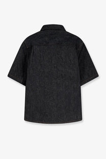 Black denim short-sleeved shirt with classic collar and subtle texture by walk in paris men’s raw denim collection