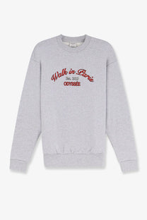 A heather gray walk in paris men’s sweatshirt with red embroidered text odyssee on the front