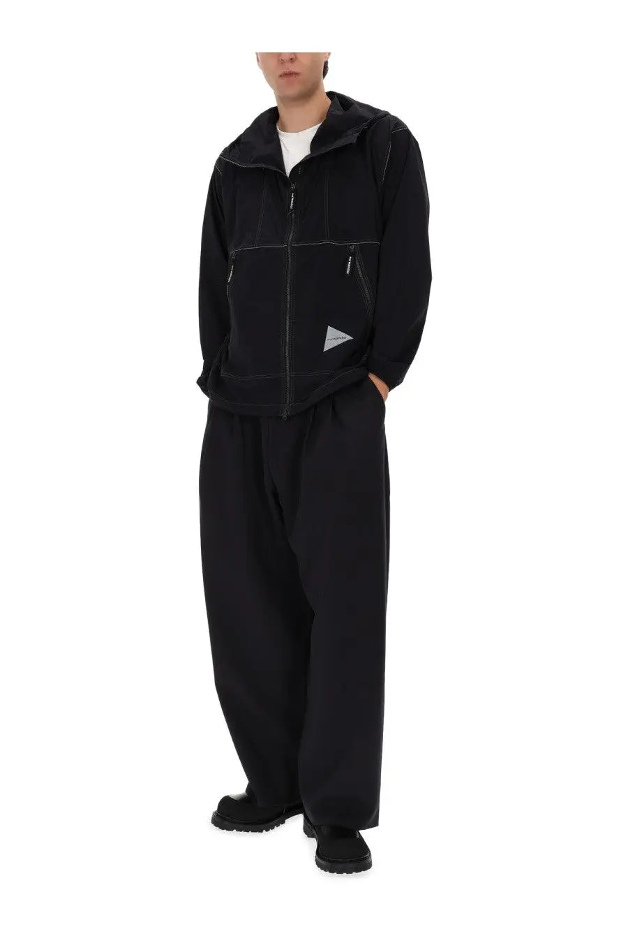 And wander men’s black partex jacket with hood and subtle triangular logo on the chest