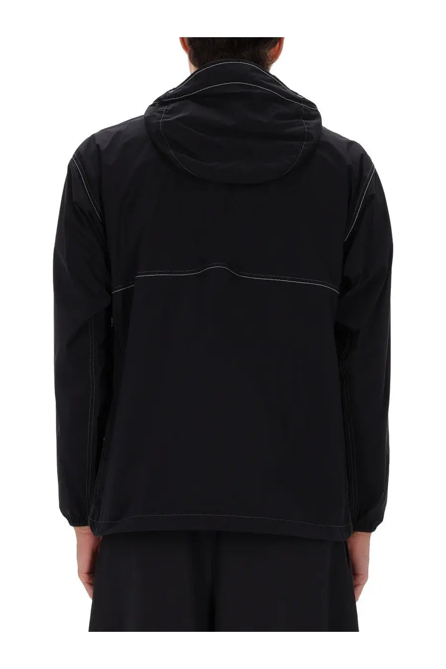 And wander men’s black partex jacket with subtle white stitching and a sleek modern design
