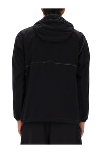 And wander men’s black partex jacket with subtle white stitching and a sleek modern design
