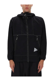 And wander men’s black partex jacket with hood contrasting white stitching and triangular logo patch on lower left side
