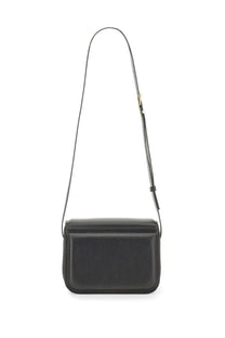 Wandler women’s medium Oscar trunk bag black leather crossbody with slender strap and gold tone hardware