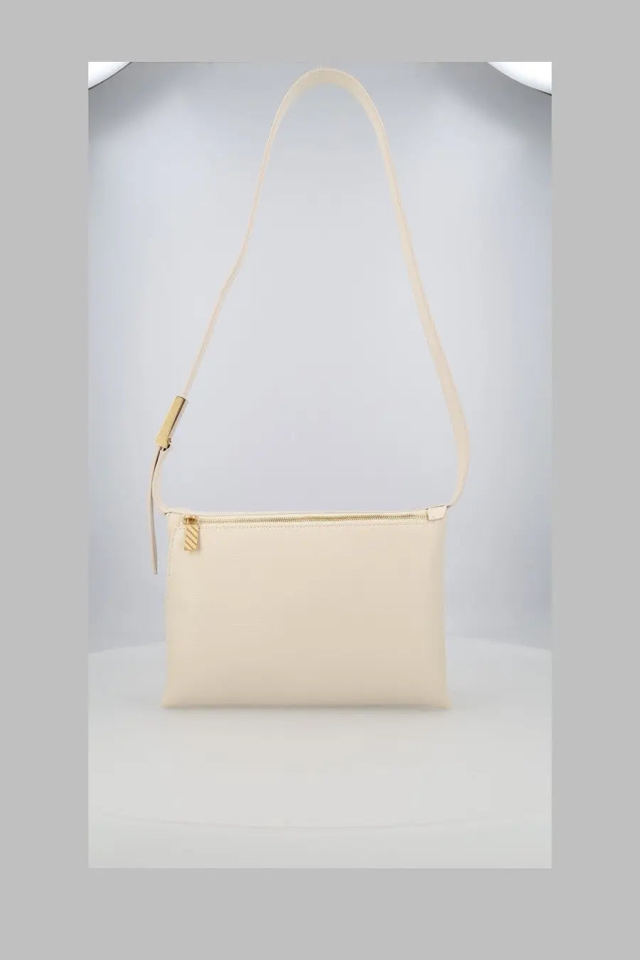 Cream-colored off-white women’s borsa spalla sandbag crossbody bag with minimalist design and gold-tone zipper hardware