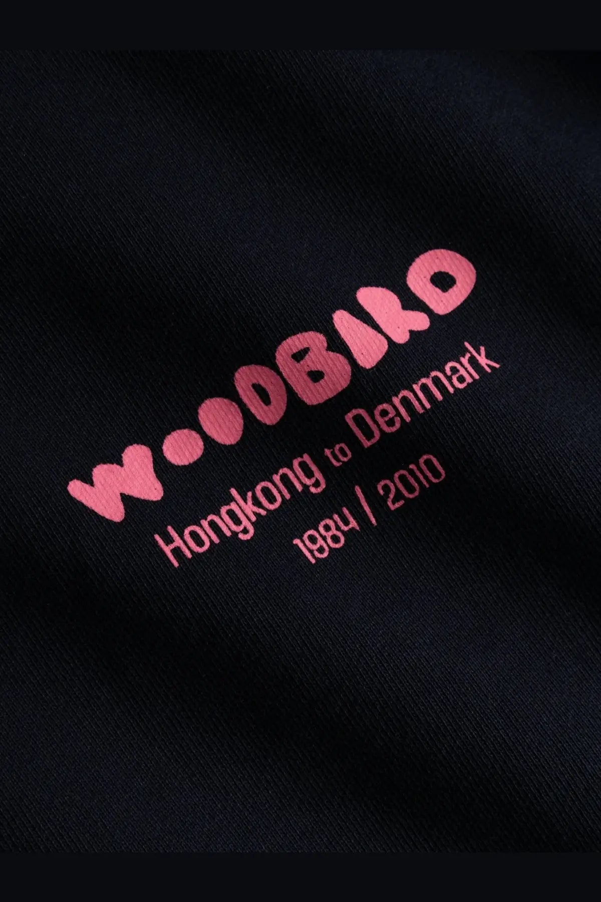 Woodbird mens wbcane organic cotton black sweatshirt with bold pink embroidered logo and hongkong to denmark text