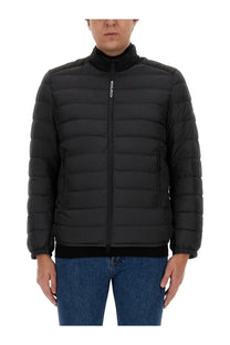 Woolrich men’s black quilted puffer jacket with high collar and zipper closure in warm insulated fabric