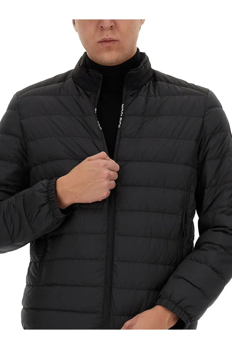 Woolrich men’s black quilted puffer jacket with high collar and zipper detail in insulated fabric