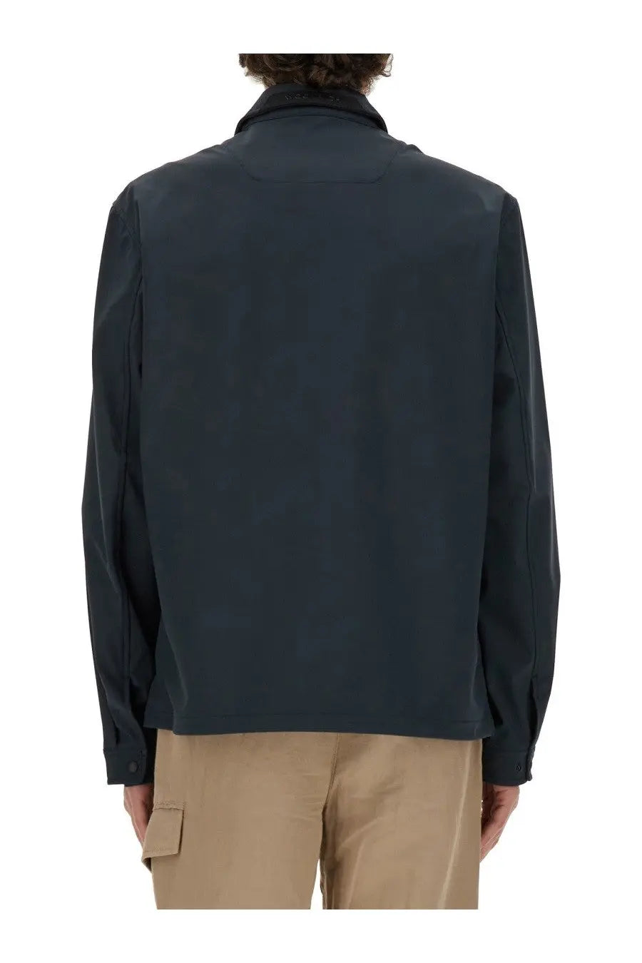 Woolrich men’s dark navy blue wool jacket with sleek modern design and subtle seam detailing in front view