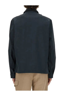Woolrich men’s dark navy blue wool jacket with sleek modern design and subtle seam detailing in front view