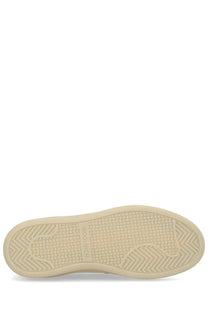 Cream-colored rubber sole with textured herringbone tread and Woodcraft branding on Woolrich men’s suede beige mocassino