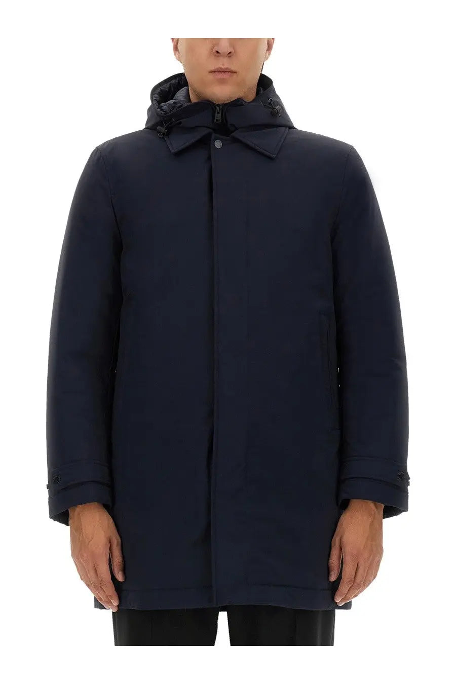 Woolrich men’s navy blue nylon jacket with a dark hooded coat featuring a structured collar and subtle stitching details