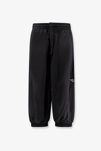 Black y-3 men’s baggy nylon track pants with drawstring waist and elastic cuffs for casual wear